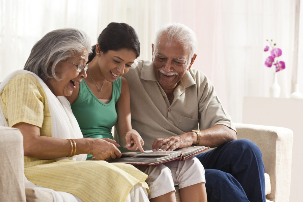 grandparents enjoying time with young adult grandchild