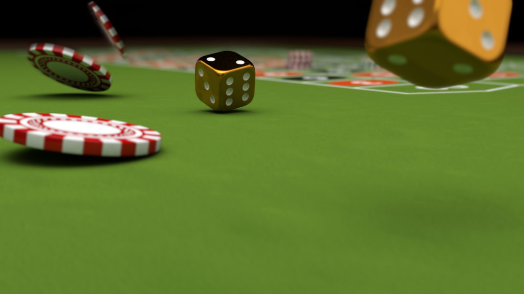 Casino theme, playing chips and gold dice on a gaming table.